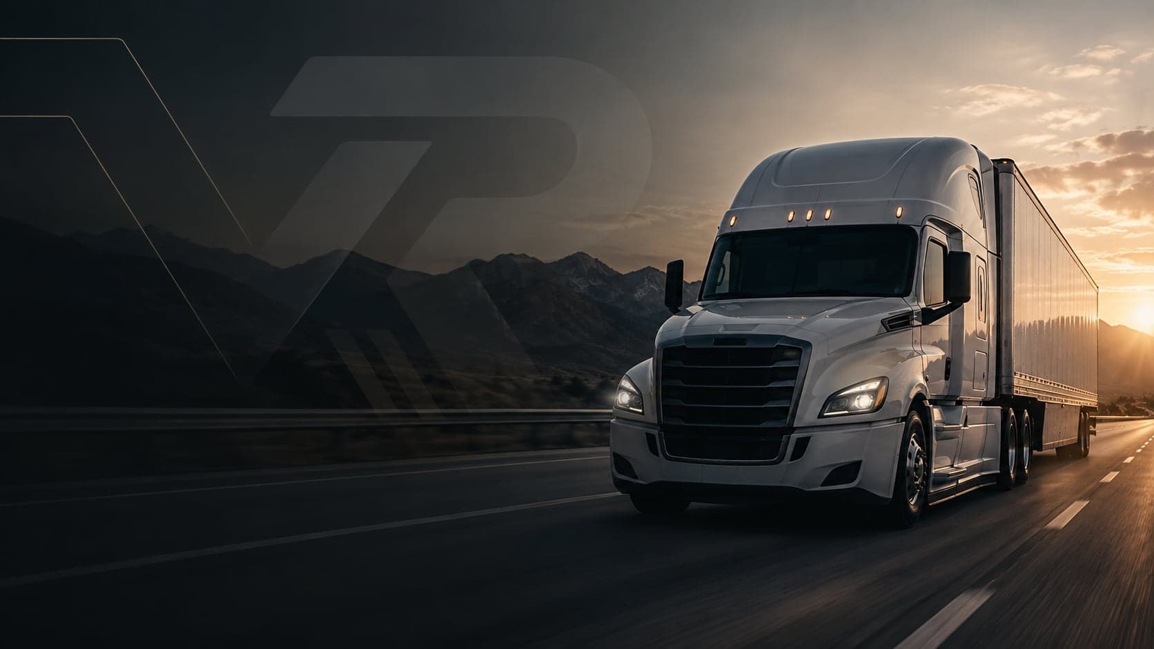 Semi truck on a mountain highway at sunset